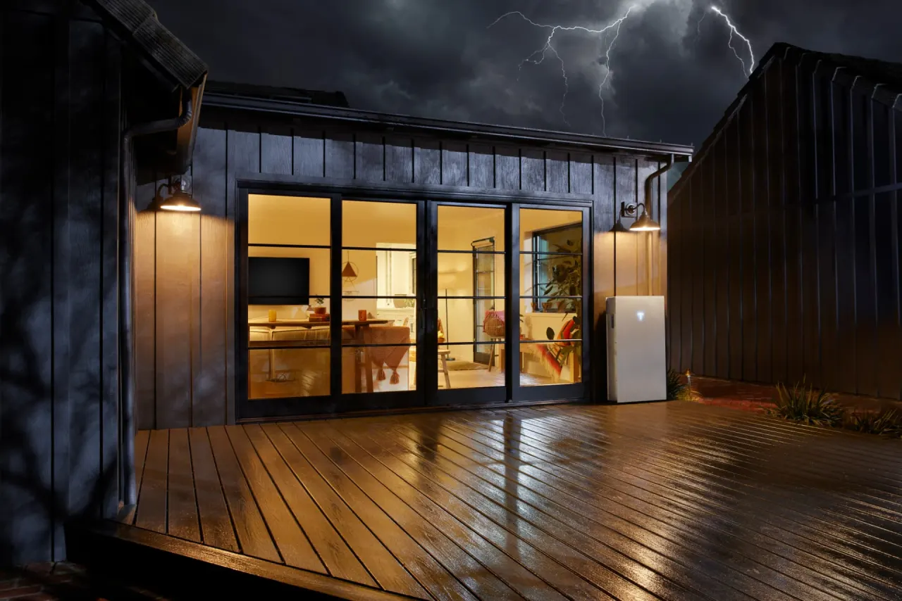 Home staying powered by a Powerwall during a nighttime storm